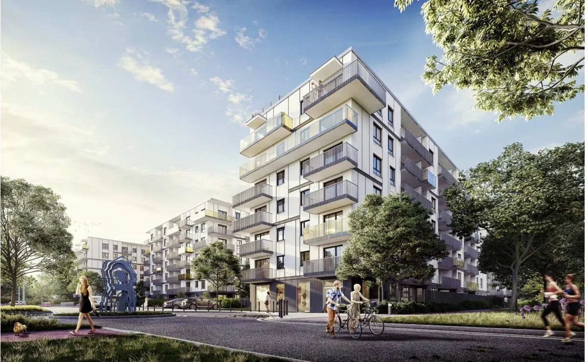 Port Żerań buildings in Warsaw seen from the street, with balconies and greenery in front of the entrance